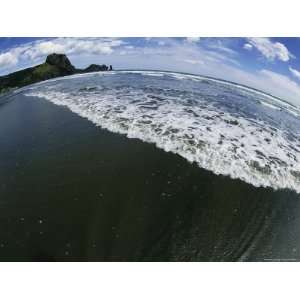  Surf Rolling in on a Black Sand Beach as Distorted Through 