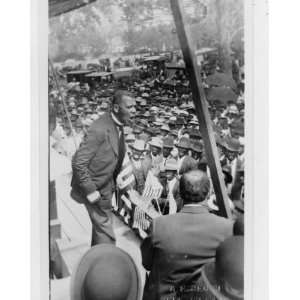  1912 photo Booker T. Washington speaking from a stage near 