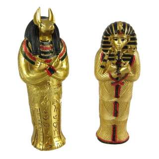   pair of metallic gold painted egyptian style sarcophagus boxes is an