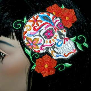 This headband is a huge Mexican Calavera Sugar Skull. It is covered in 