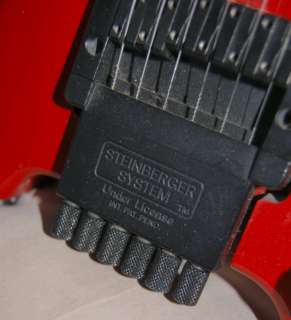   Tremolo solid body, headless, electric guitar, licensed by Steinberger