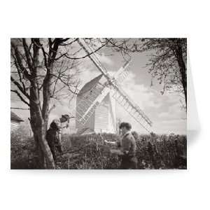  Men chopping wood near a windmill   Greeting Card (Pack of 