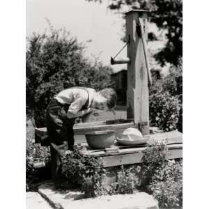  Farm Boy in Overalls, Leaning Down By Water Pump, Washing 