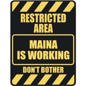   RESTRICTED AREA MAINA IS WORKING  PARKING SIGN