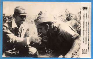 WW2 Japanese Officer Light Cigarette for POW News Photo  