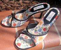 Made in Italy. Multi color floral canvas with black leather trim with 