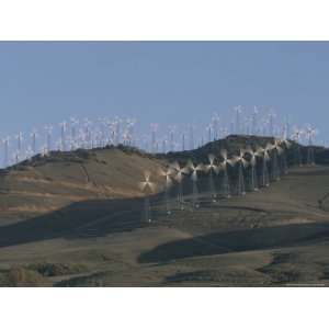 Rows of Spinning Wind Turbines Generate Electricity Photographic 